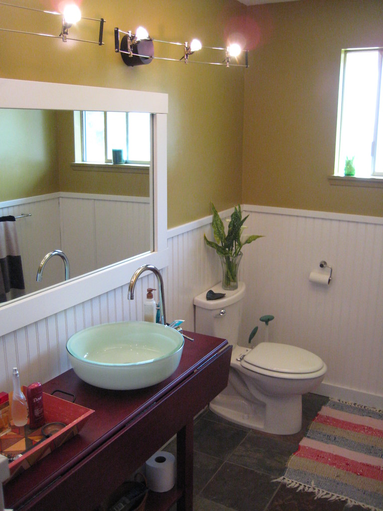 Bathroom vanity, mirror and toilet
