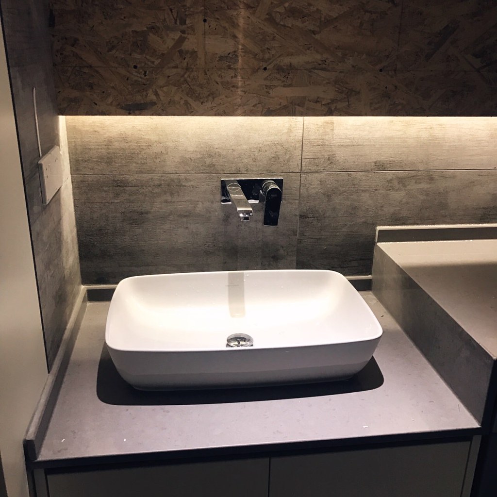Modern vessel basin with wall-mounted tap